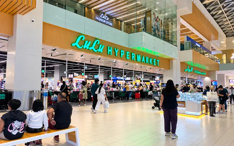 Silicon Central Mall featuring a bright LuLu Hypermarket entrance and shoppers inside the modern mall atrium.