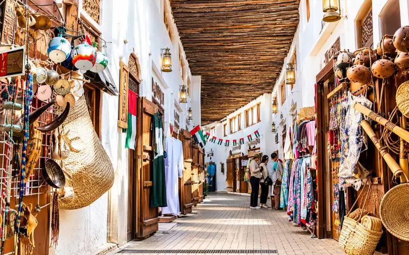 Souq Al Arsah Sharjah traditional market walkway and clothing shops