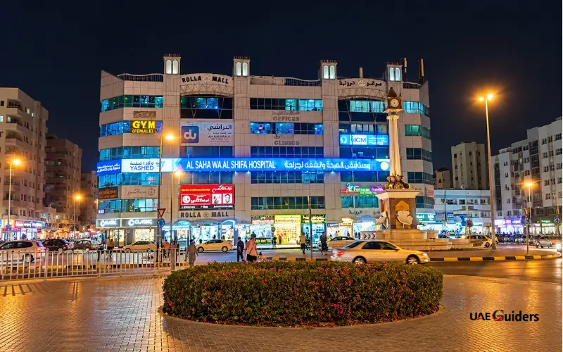 Rolla Mall Sharjah illuminated exterior at night