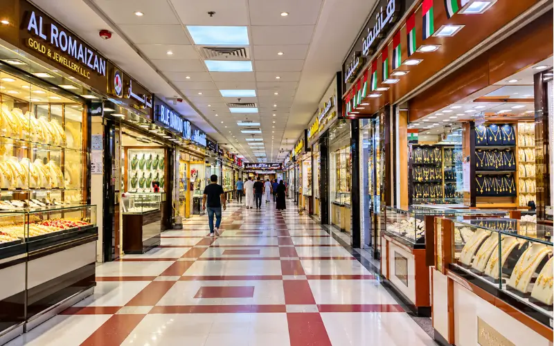Ajman Gold Market jewellery shops with gold displays.