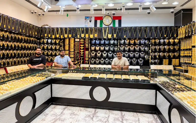 Gold necklaces and bracelets displayed in an Ajman jewellery shop.